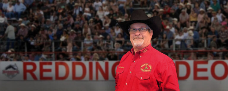 Man in a cowboy hat at a rodeo